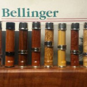 A display of different types of sauces on top of a shelf.