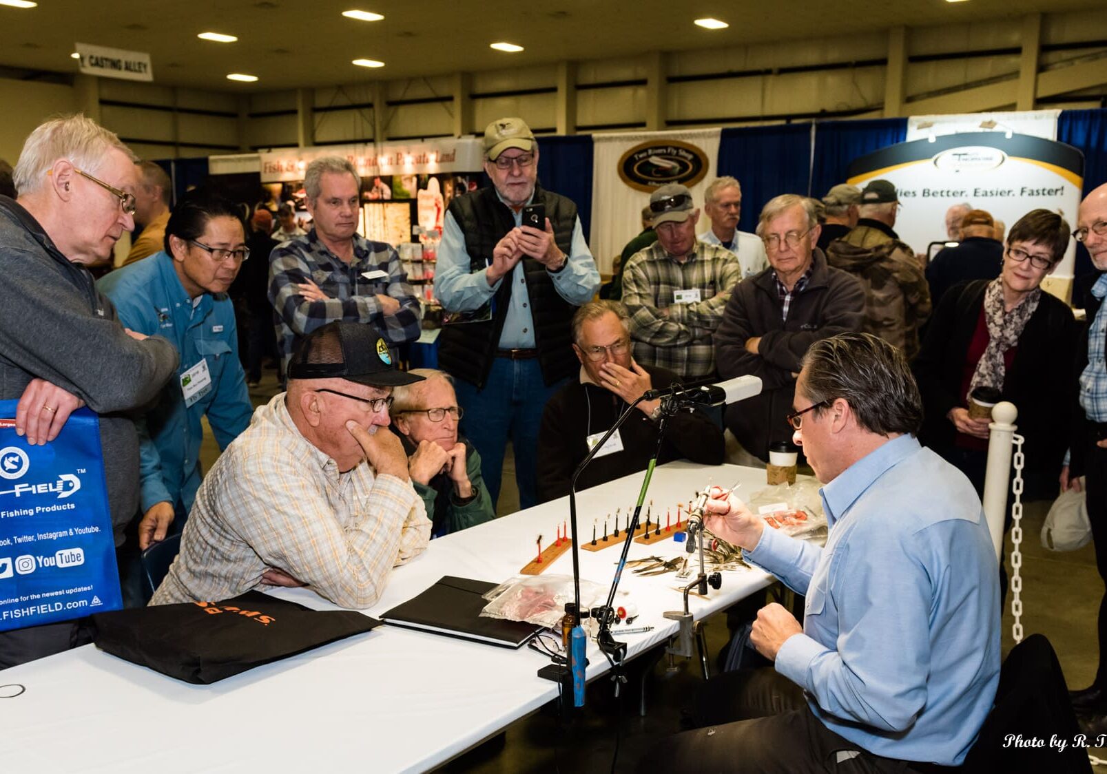 A group of people sitting around a table.